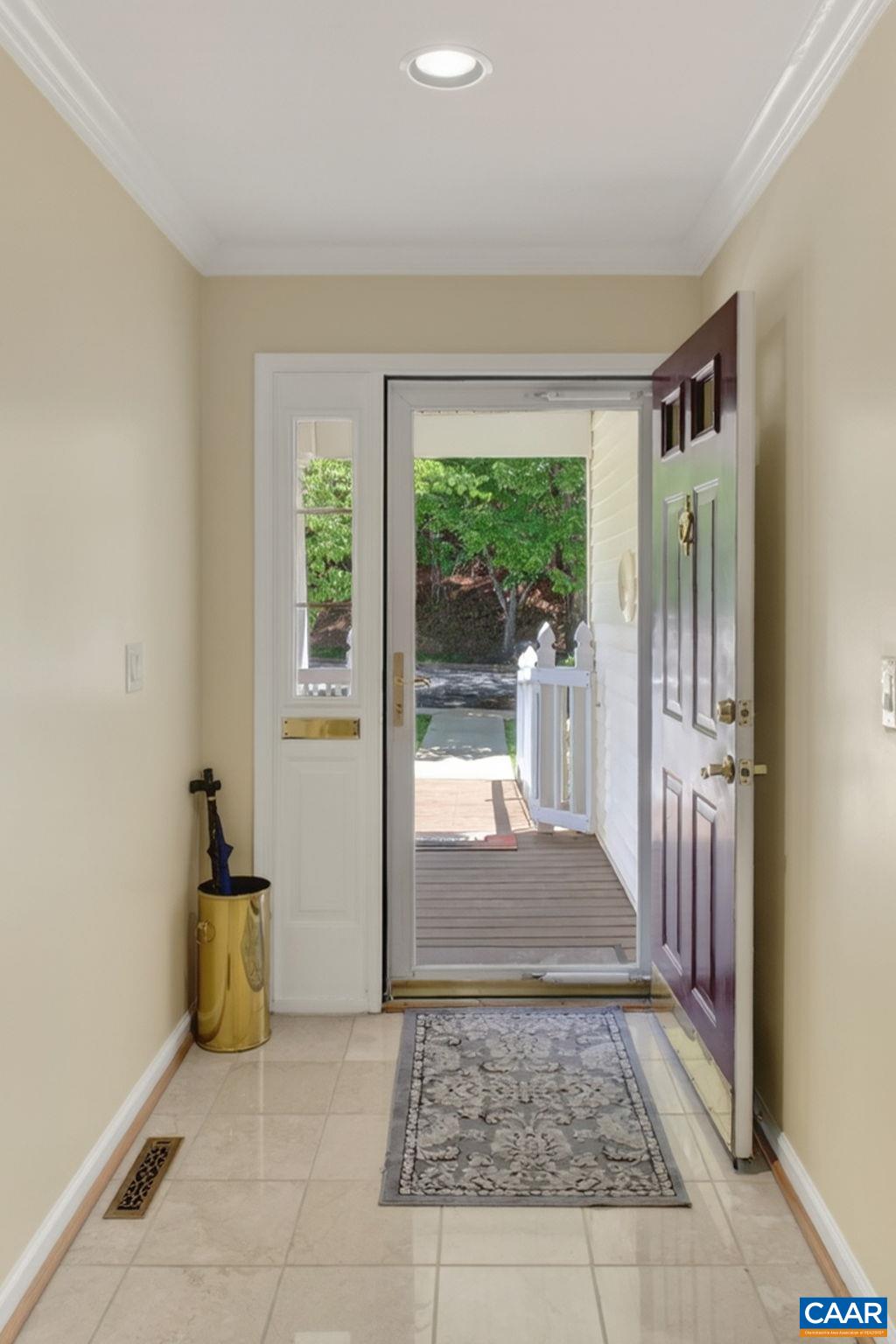 590 Mockingbird Way Charlottesville, VA 22901 - Photo 4 of 43 a view of a hallway to a livingroom with furniture and front door
