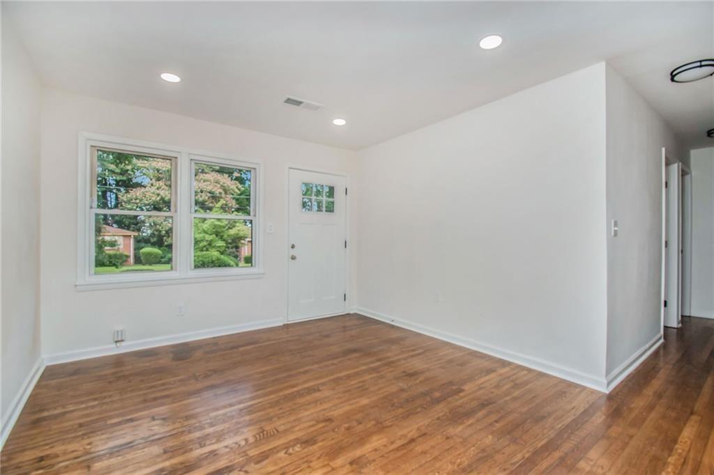980 Fairburn Road Northwest Atlanta, GA 30331 - Photo 4 of 8 a view of empty room with wooden floor and fan