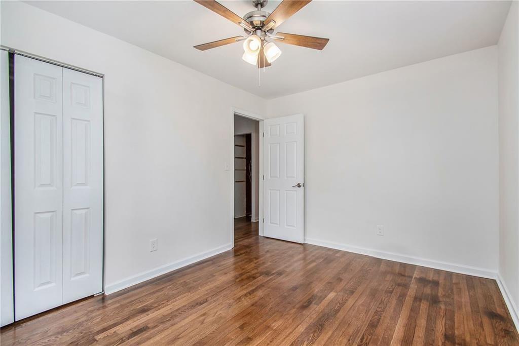 980 Fairburn Road Northwest Atlanta, GA 30331 - Photo 6 of 8 wooden floor in an empty room with a window