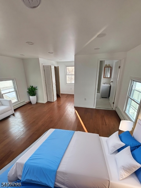 45 Mechanic Street Washington, NJ 07882 - Photo 2 of 3 a room with wooden floor and furniture