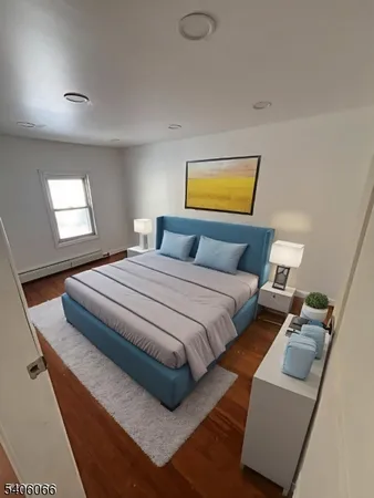 a bedroom with bed and window