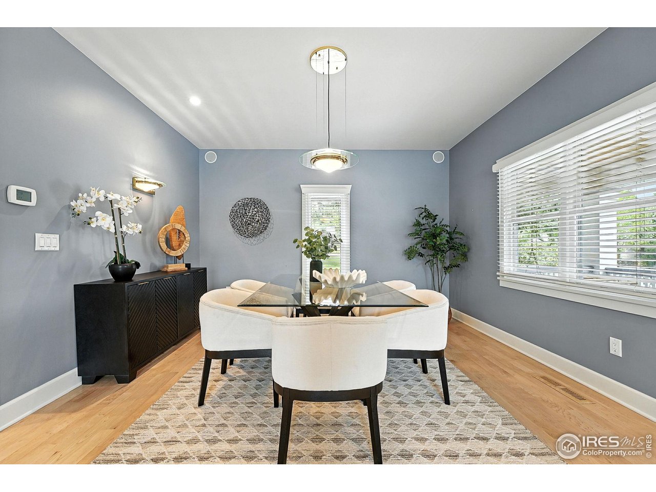 3561 4th Street Boulder, CO 80304 - Photo 13 of 50 a dining room with furniture a chandelier and window