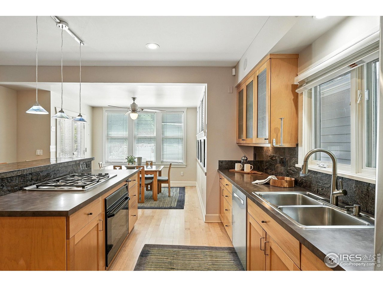 3561 4th Street Boulder, CO 80304 - Photo 20 of 50 a kitchen with stainless steel appliances granite countertop a sink stove and cabinets