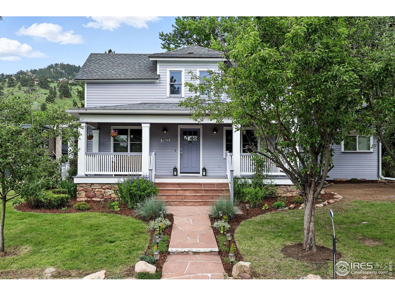 3561 4th Street Boulder, CO 80304 - Photo 2 of 50 a front view of a house with garden