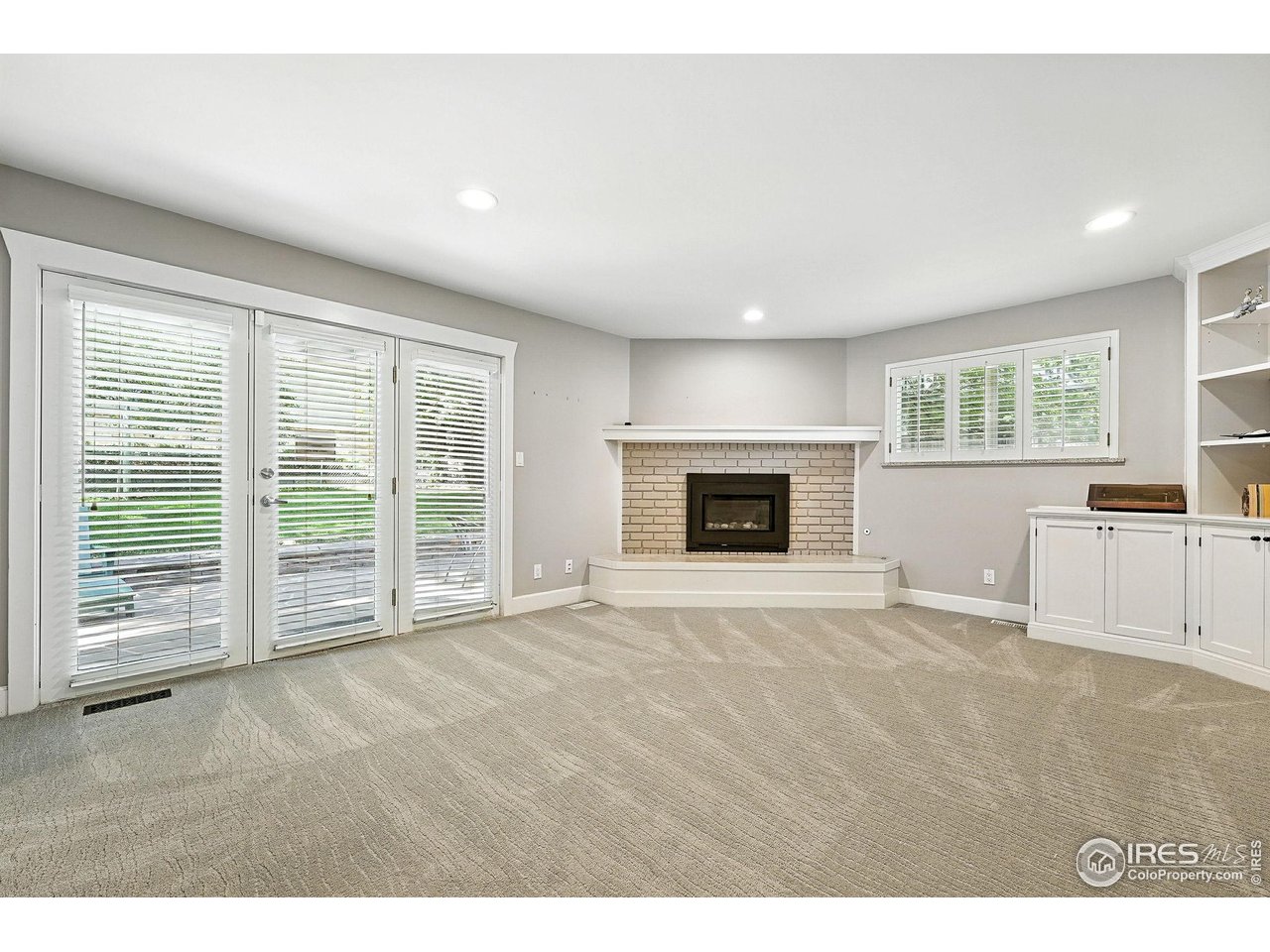 3561 4th Street Boulder, CO 80304 - Photo 22 of 50 a view of an empty room with a fireplace and a window