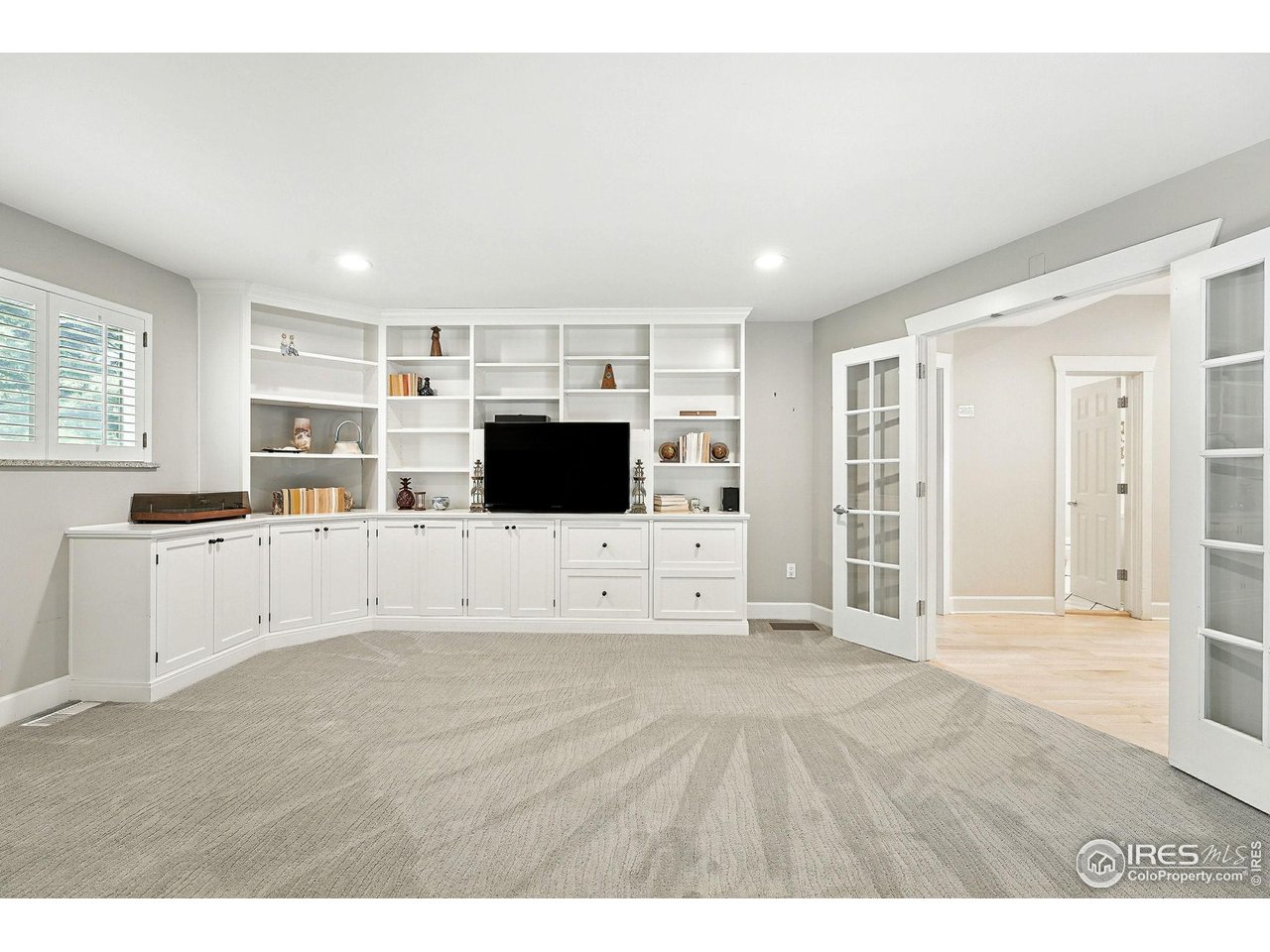 3561 4th Street Boulder, CO 80304 - Photo 24 of 50 a living room with stainless steel appliances kitchen island granite countertop a refrigerator a sink dishwasher and white cabinets with wooden floor