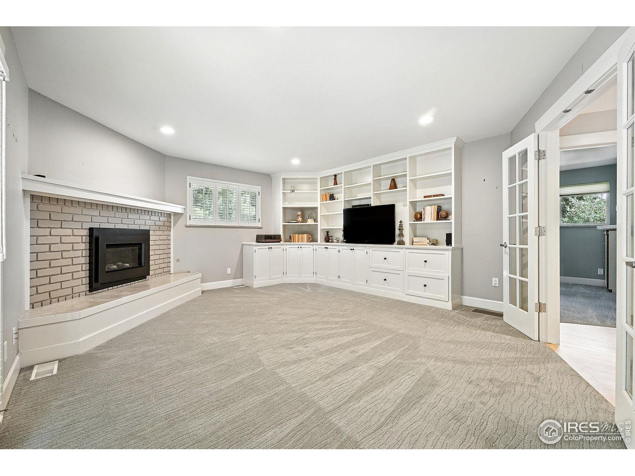 3561 4th Street Boulder, CO 80304 - Photo 25 of 50 a living room with furniture and a fireplace with kitchen view