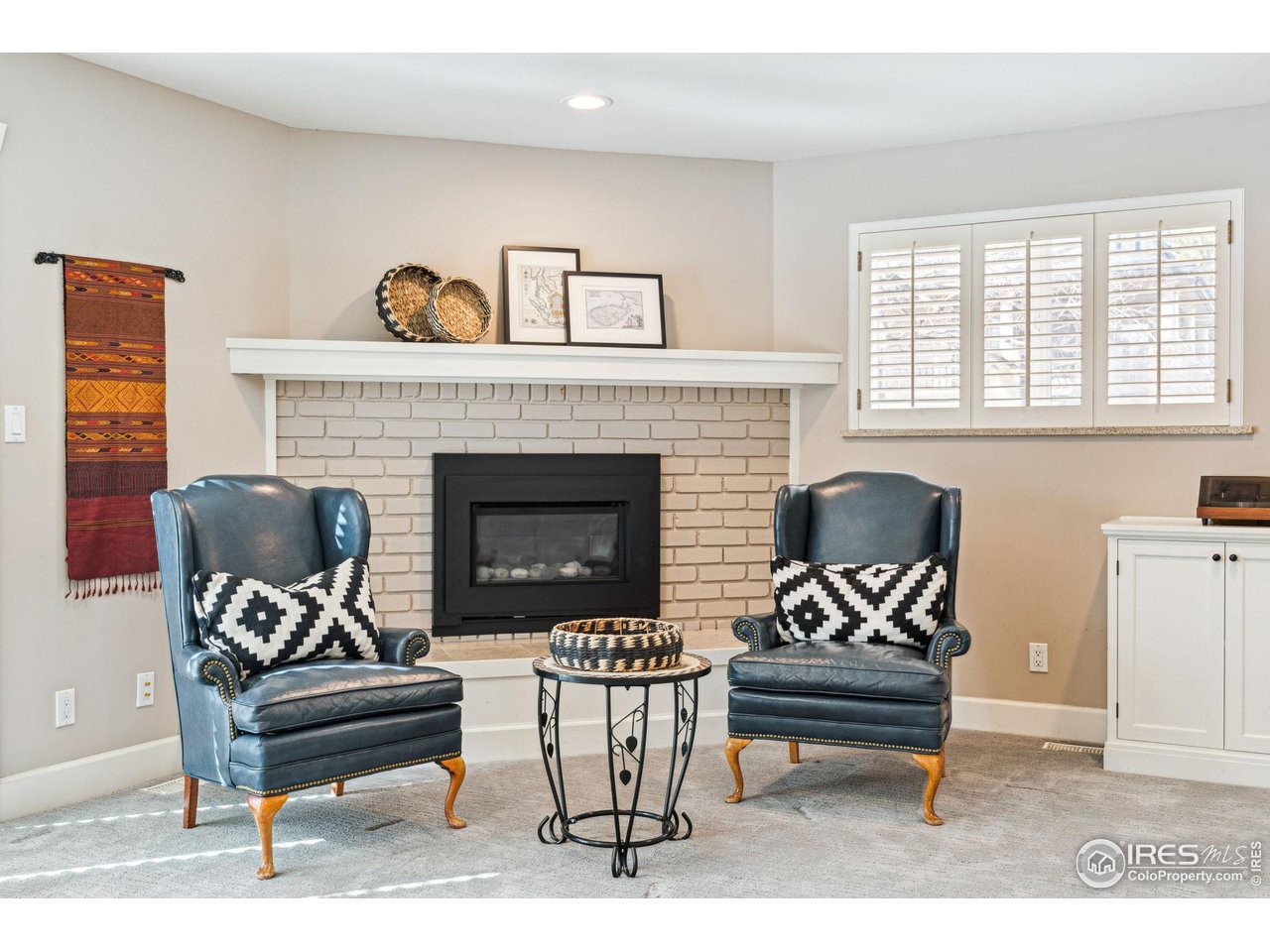 3561 4th Street Boulder, CO 80304 - Photo 26 of 50 a living room with furniture a fireplace and next to a window