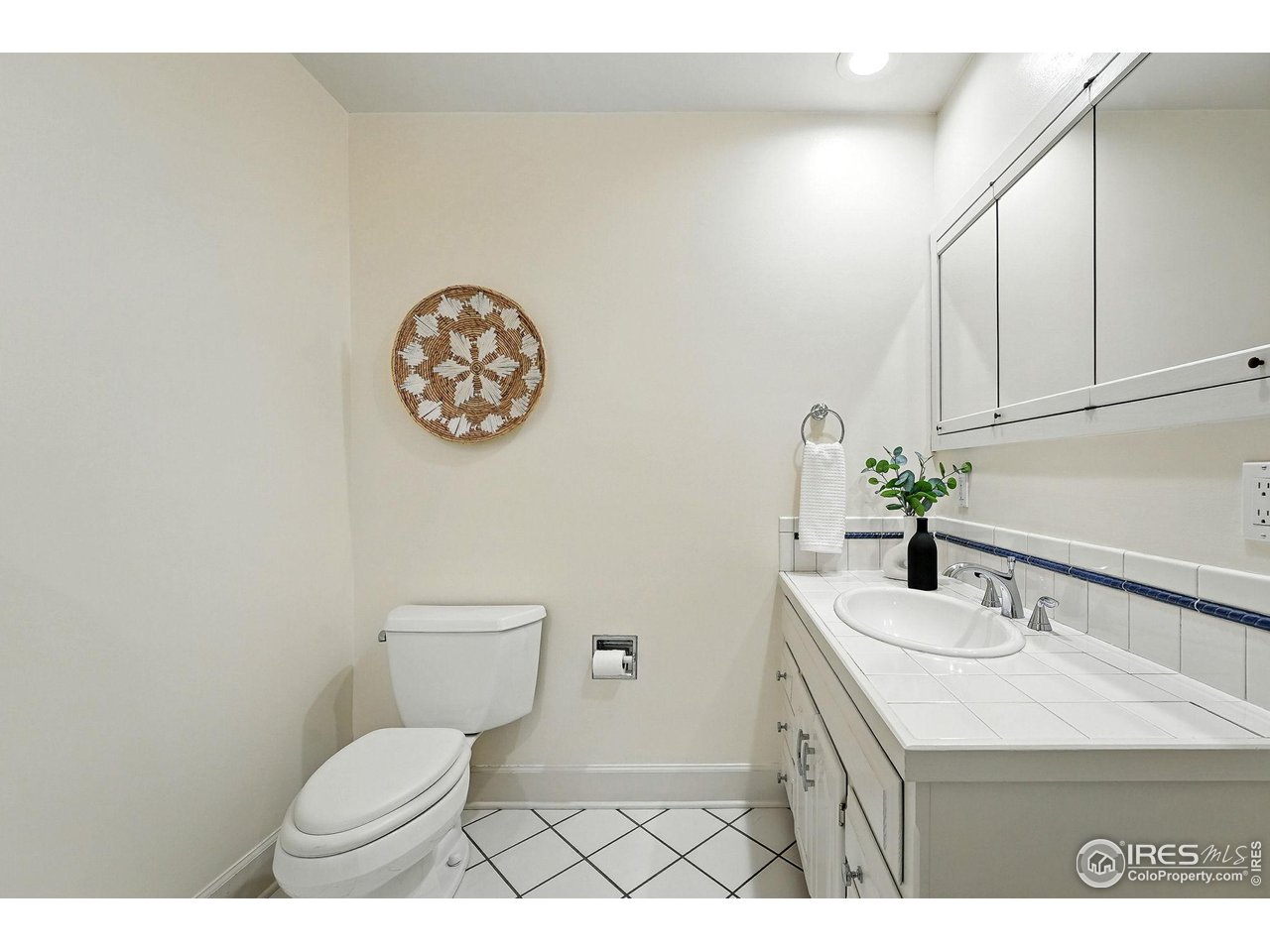 3561 4th Street Boulder, CO 80304 - Photo 27 of 50 a bathroom with a sink a toilet and a mirror