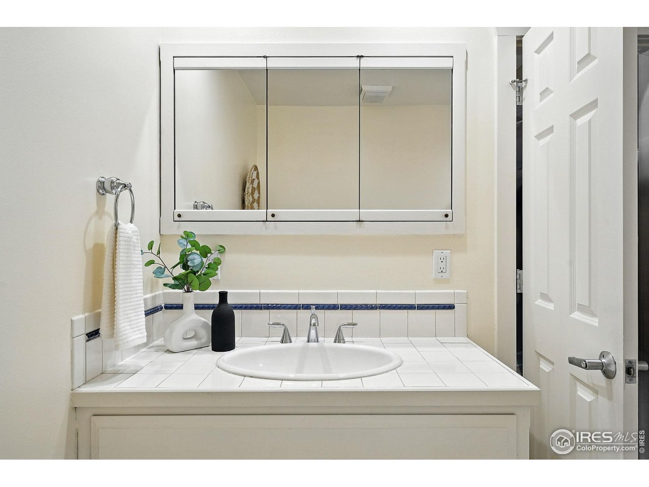 3561 4th Street Boulder, CO 80304 - Photo 28 of 50 a bathroom with a sink a mirror and a window