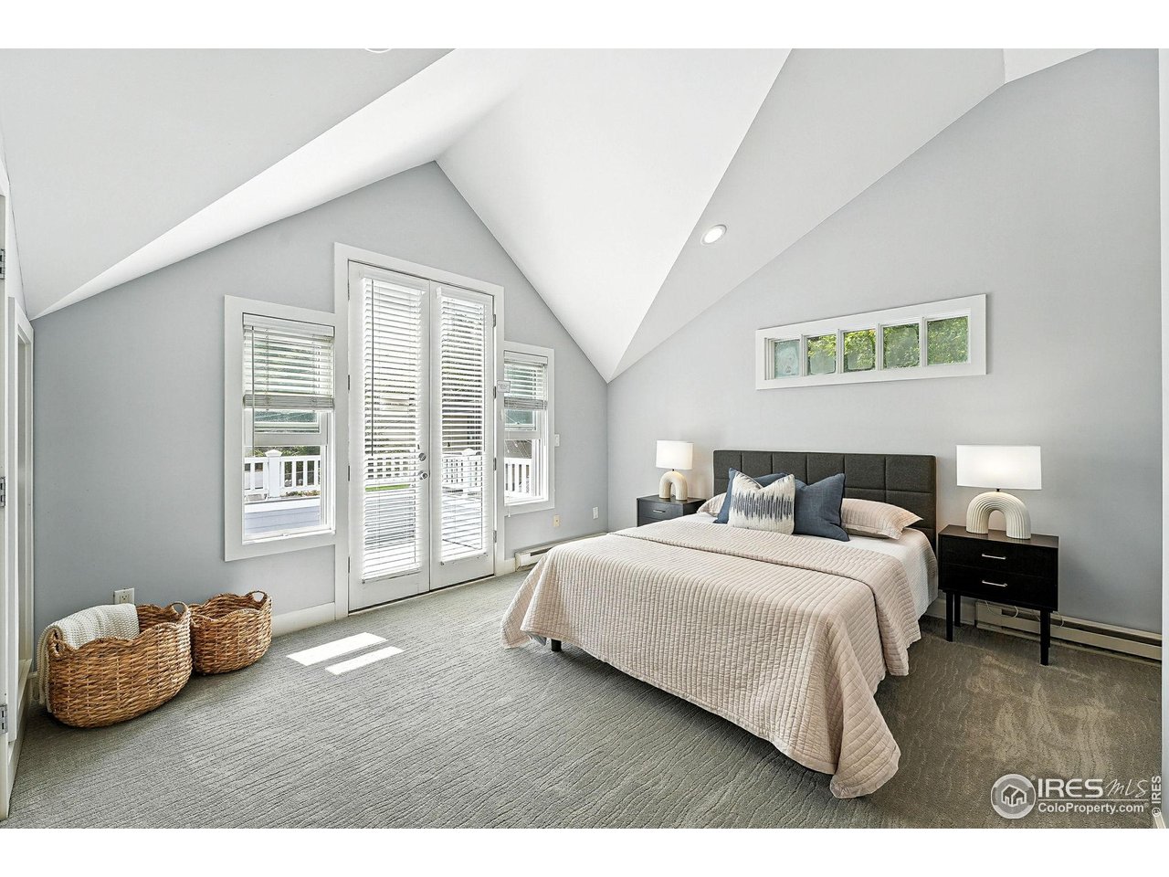 3561 4th Street Boulder, CO 80304 - Photo 29 of 50 a bedroom with a bed and a couch