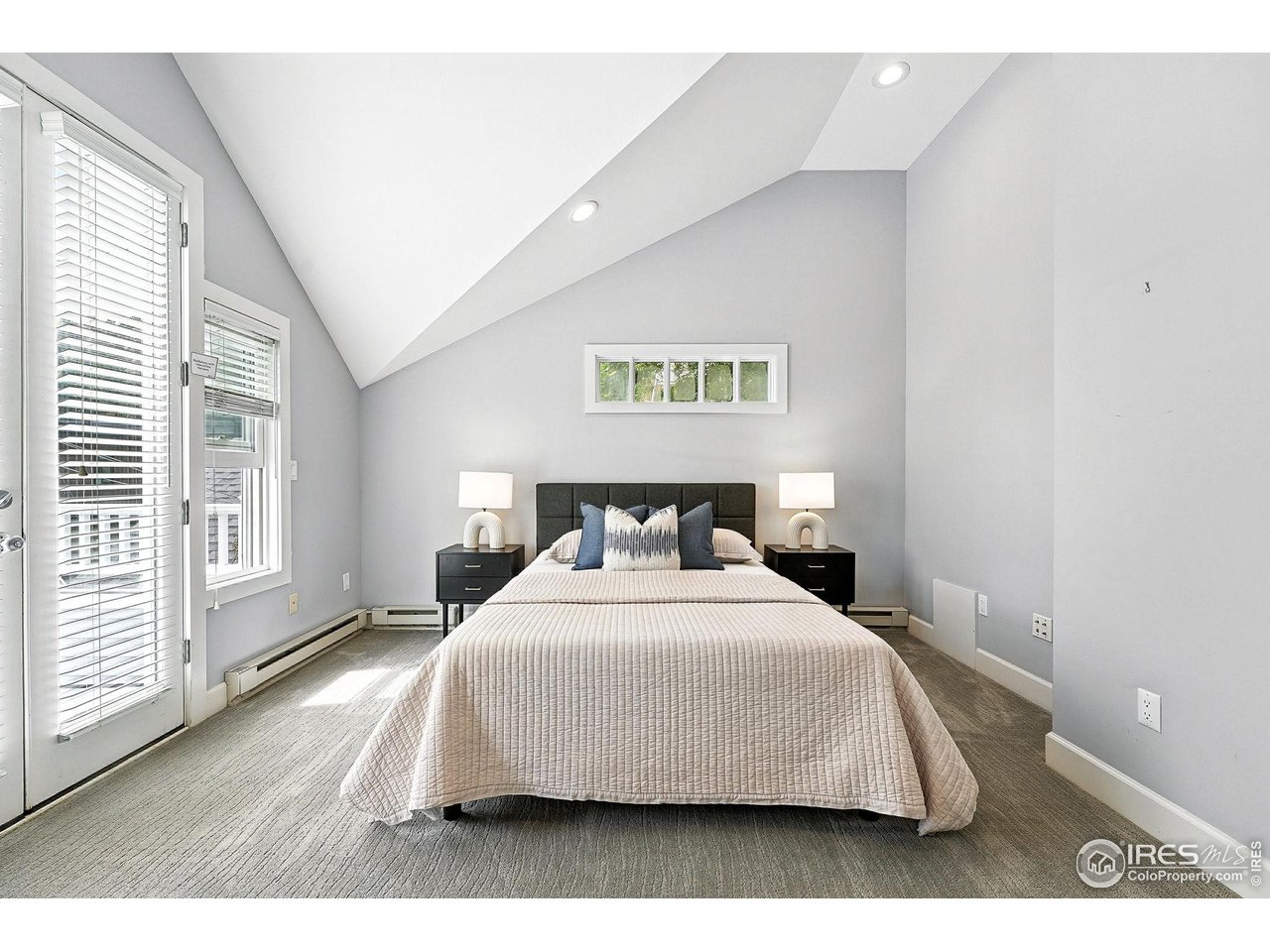 3561 4th Street Boulder, CO 80304 - Photo 30 of 50 a bedroom with a bed and window
