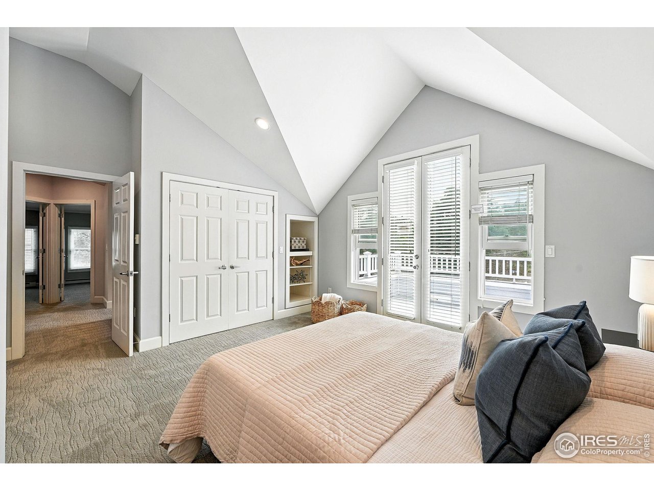 3561 4th Street Boulder, CO 80304 - Photo 32 of 50 a bedroom with a bed next to a large window