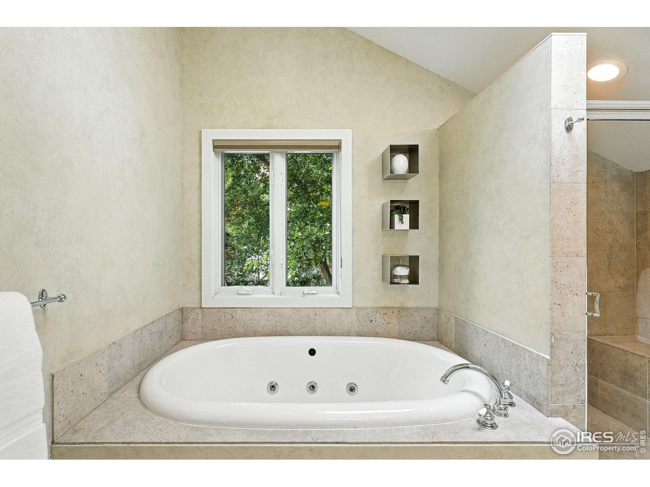 3561 4th Street Boulder, CO 80304 - Photo 36 of 50 a bath tub sitting in a bathroom next to a window