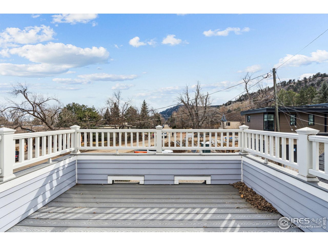 3561 4th Street Boulder, CO 80304 - Photo 37 of 50 a view of a chair and table on the roof deck