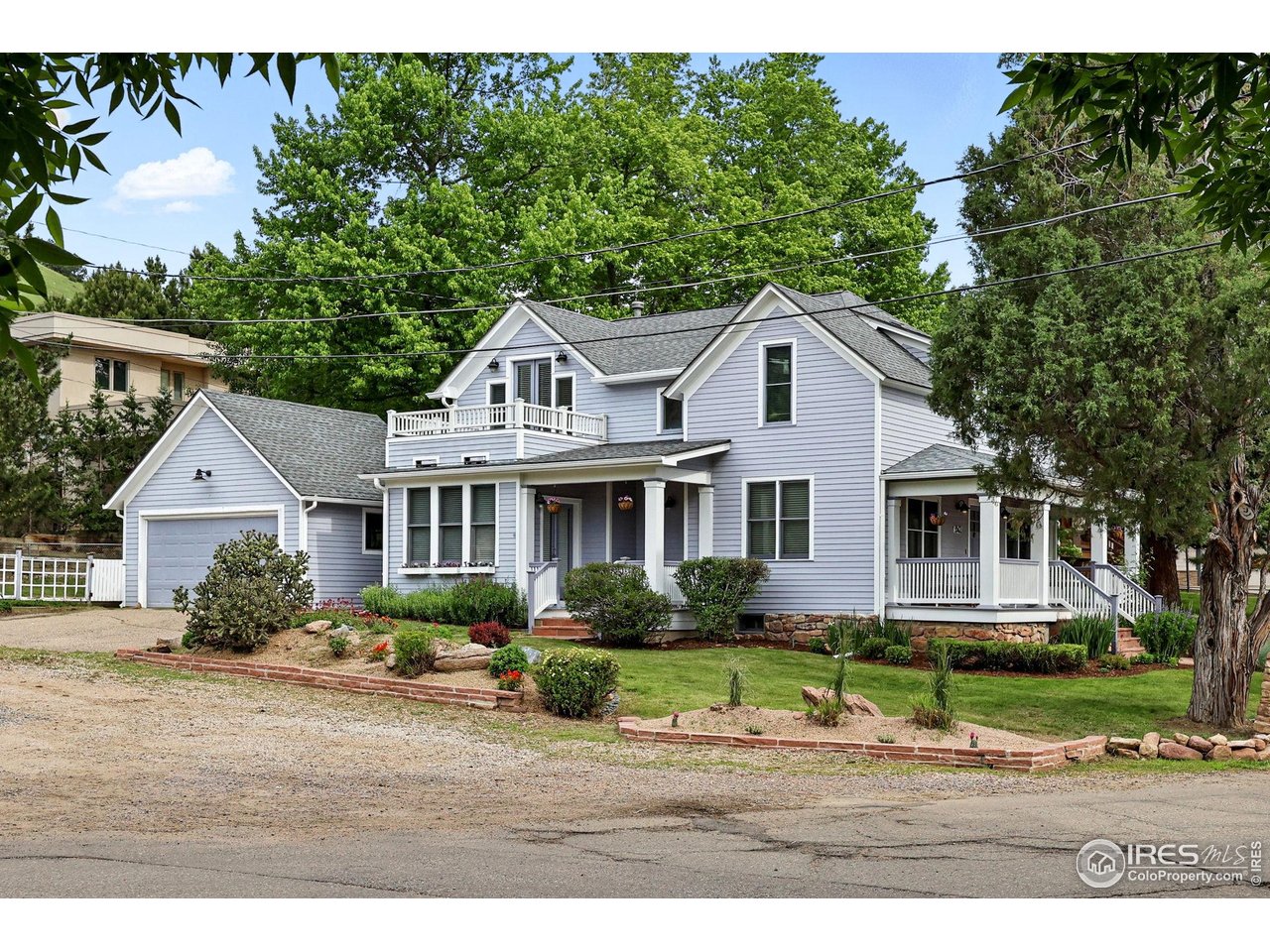 3561 4th Street Boulder, CO 80304 - Photo 4 of 50 a front view of a house with a garden