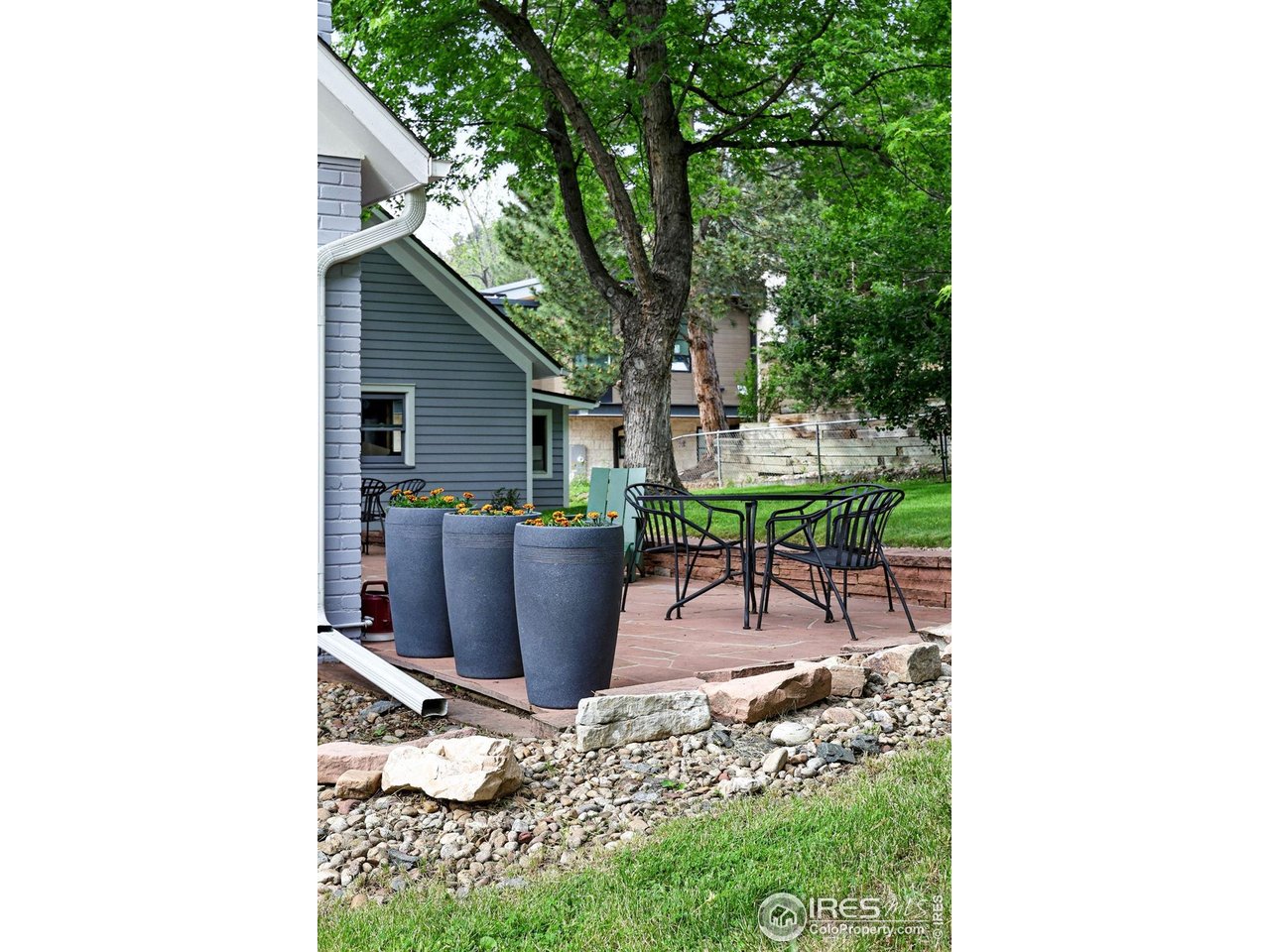 3561 4th Street Boulder, CO 80304 - Photo 48 of 50 a view of a patio with table and chairs and potted plants