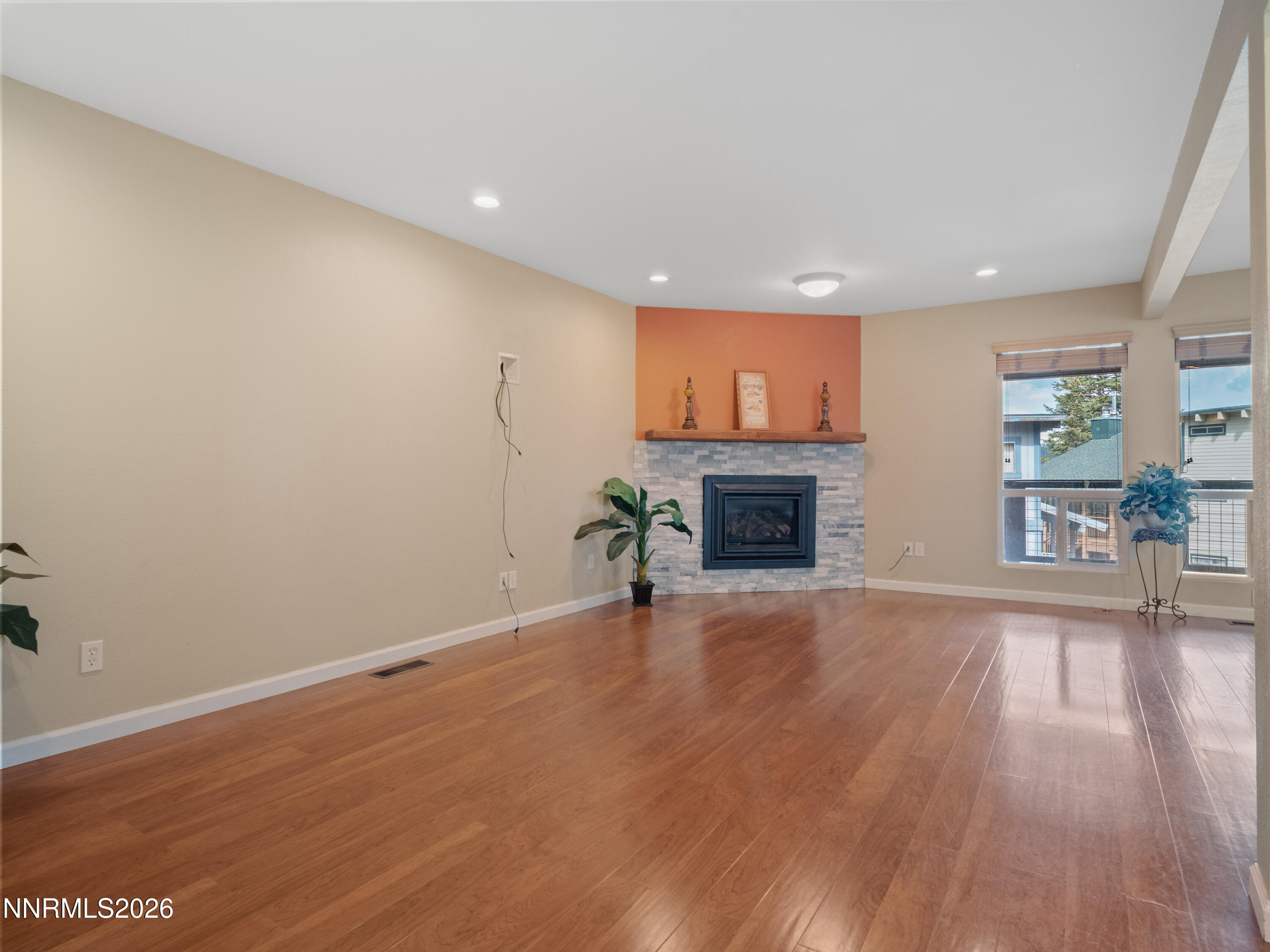 761 Milky Way Court, Unit A Stateline, NV 89449 - Photo 15 of 43 a view of empty room with wooden floor and fireplace