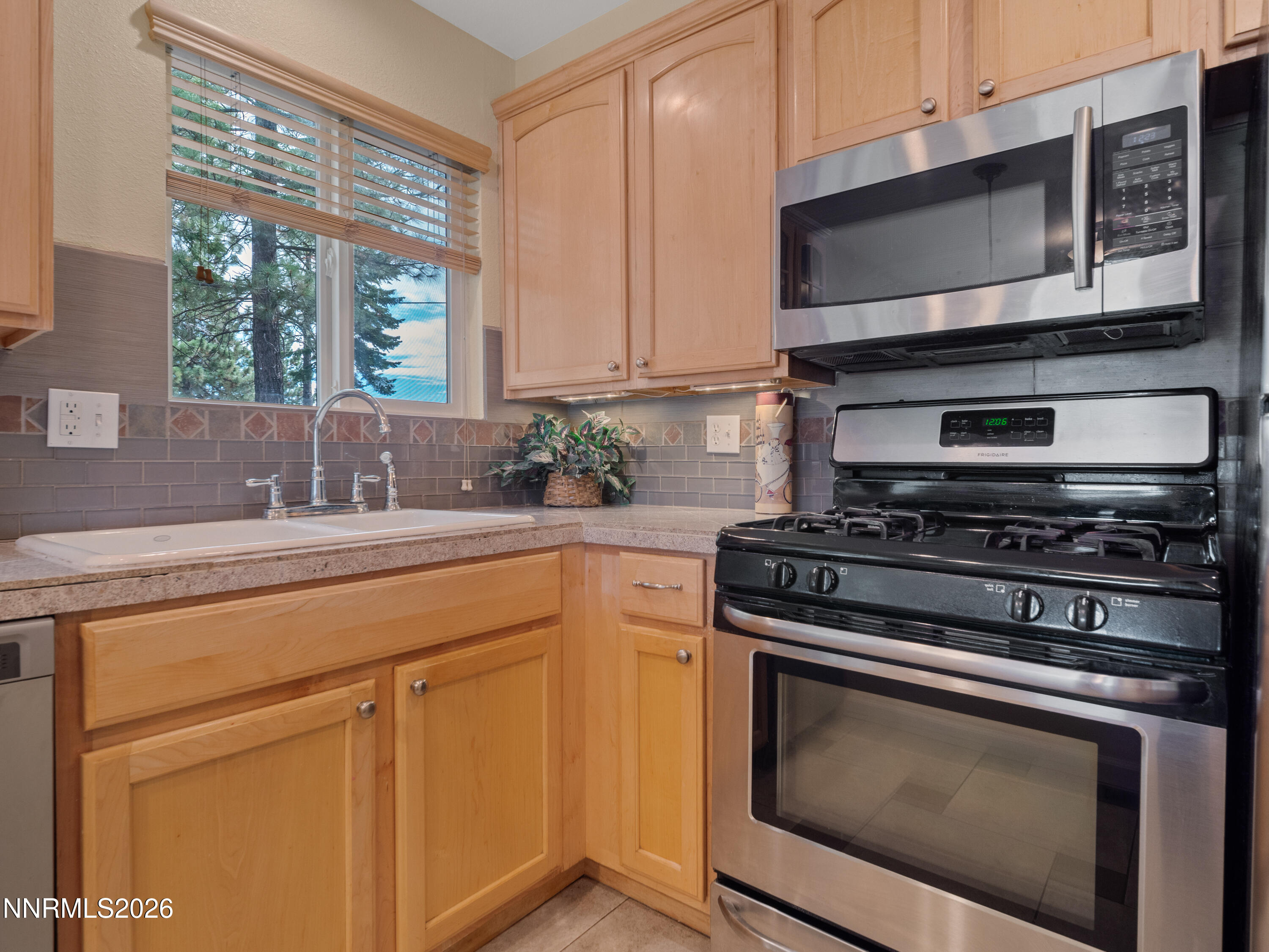 761 Milky Way Court, Unit A Stateline, NV 89449 - Photo 20 of 43 a kitchen with appliances a sink and a microwave
