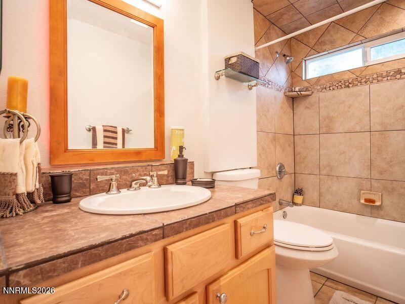 761 Milky Way Court, Unit A Stateline, NV 89449 - Photo 23 of 43 a bathroom with a sink a toilet and shower