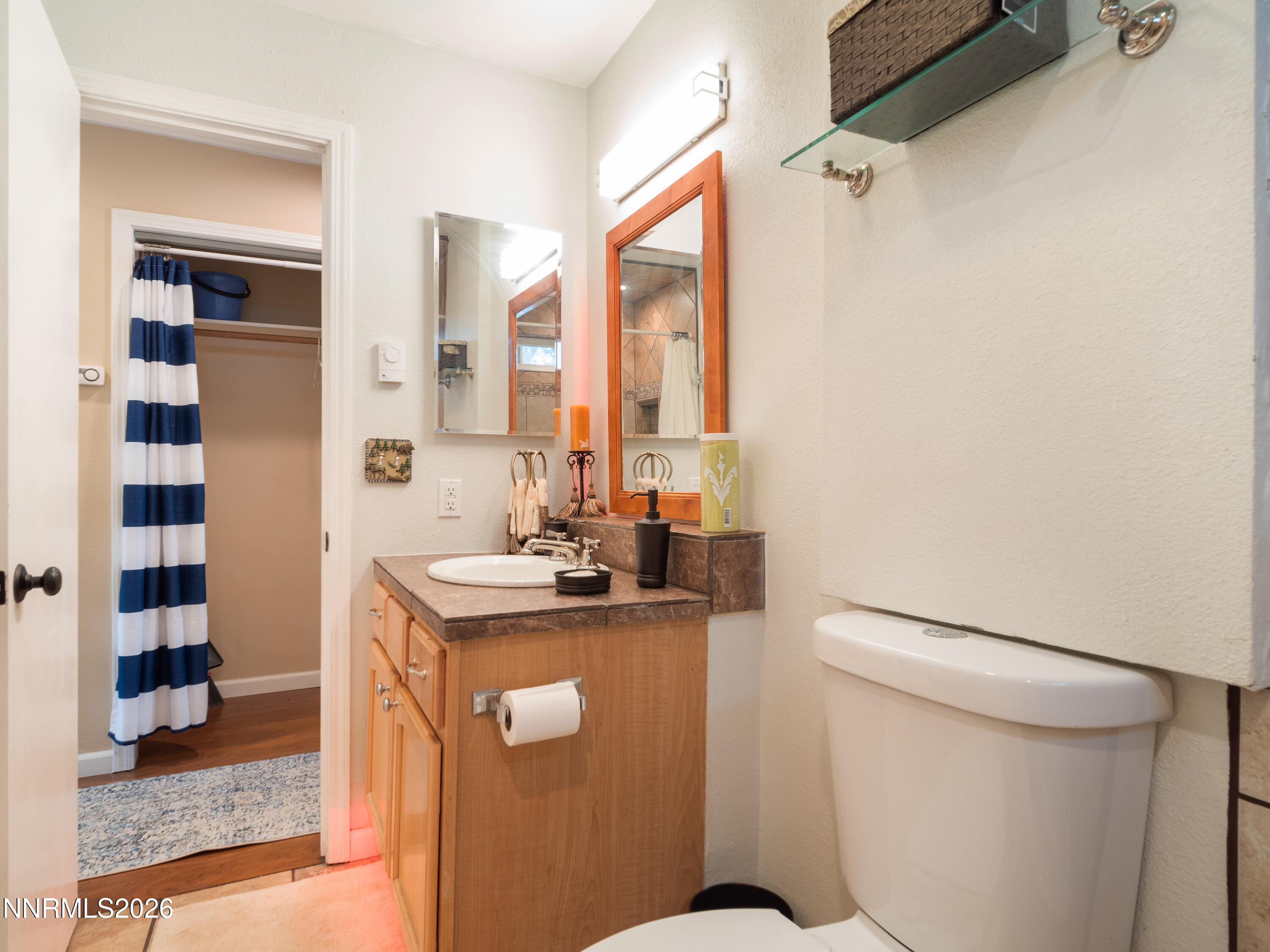 761 Milky Way Court, Unit A Stateline, NV 89449 - Photo 24 of 43 a bathroom with a granite countertop sink toilet and shower