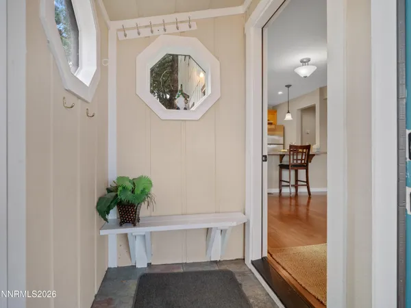 a view of a kitchen with dining table and chairs