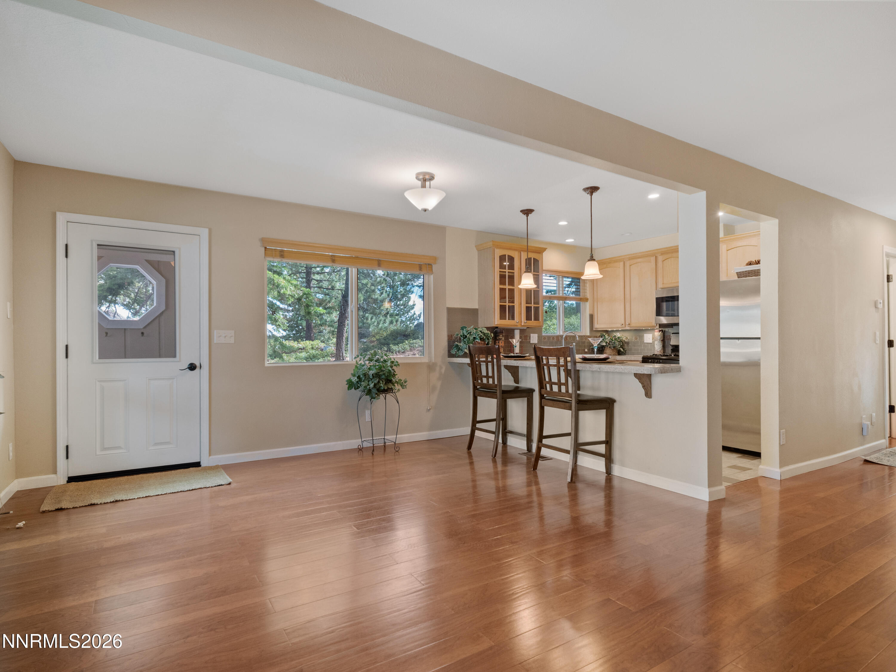 761 Milky Way Court, Unit A Stateline, NV 89449 - Photo 7 of 43 a view of a kitchen with dining table and chairs