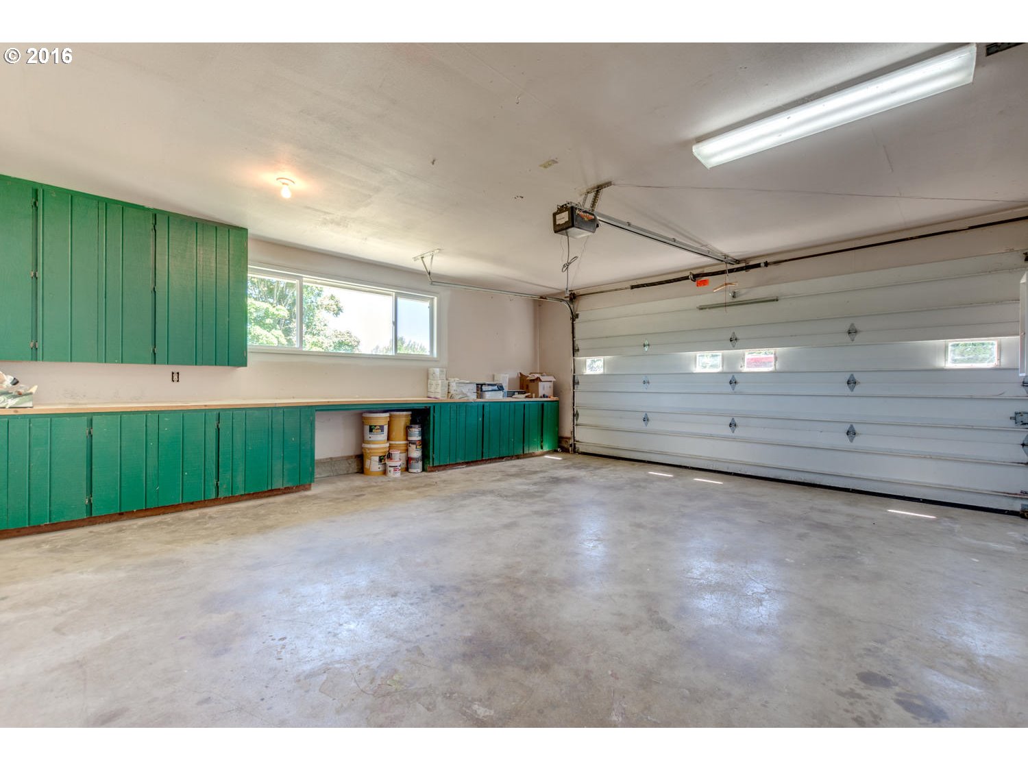 8473 South Heinz Road Canby, OR 97013 - Photo 11 of 32 a view of an empty room with windows and cabinet