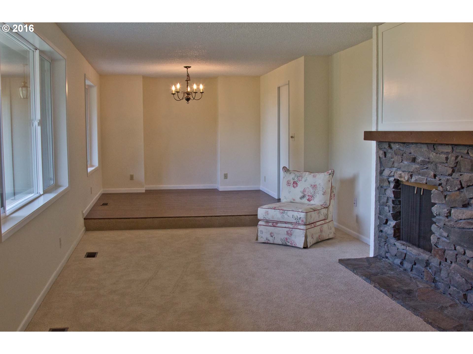 8473 South Heinz Road Canby, OR 97013 - Photo 6 of 32 a living room with furniture and a fireplace
