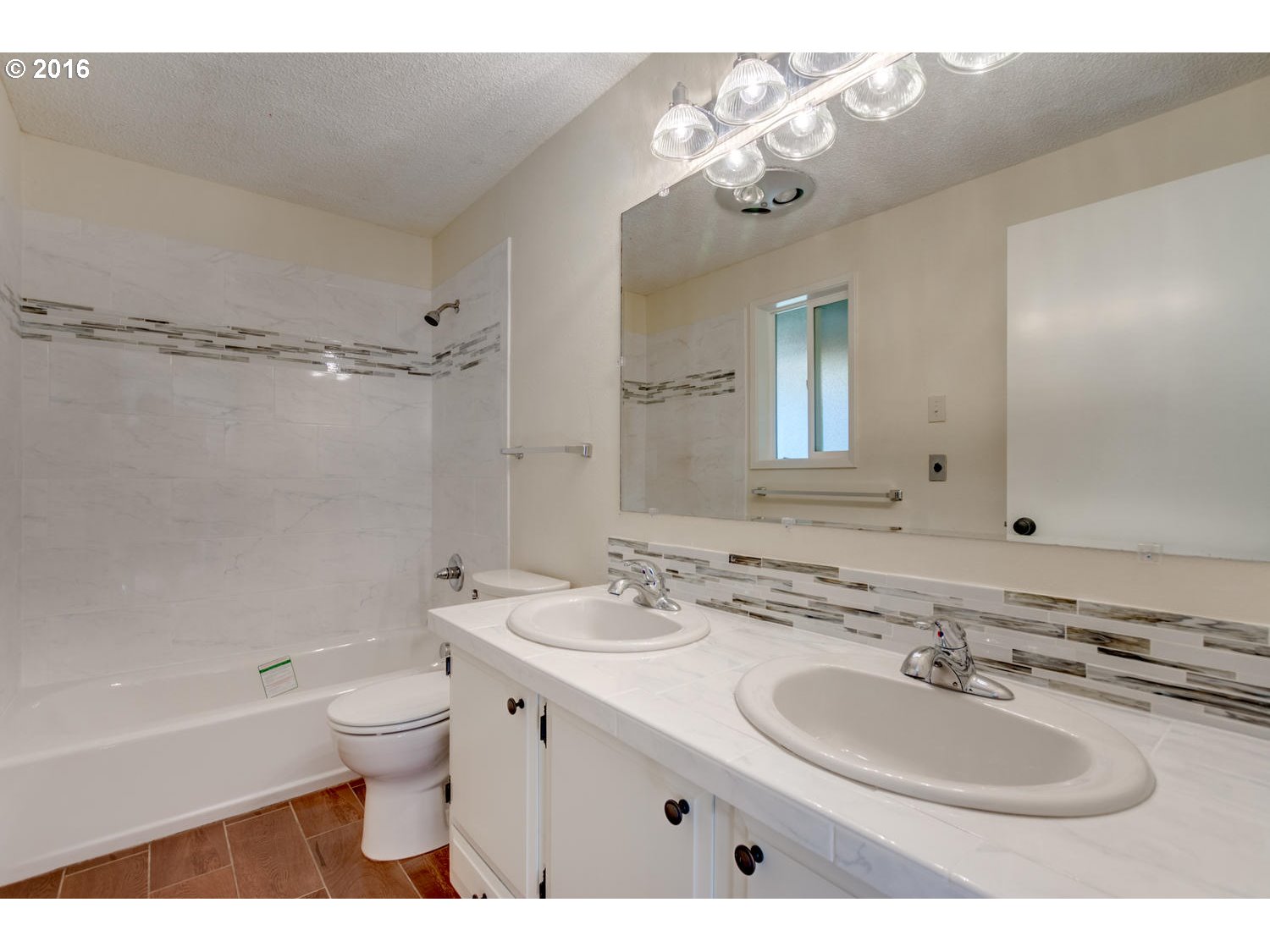 8473 South Heinz Road Canby, OR 97013 - Photo 10 of 32 a bathroom with a sink double vanity granite tub and a mirror