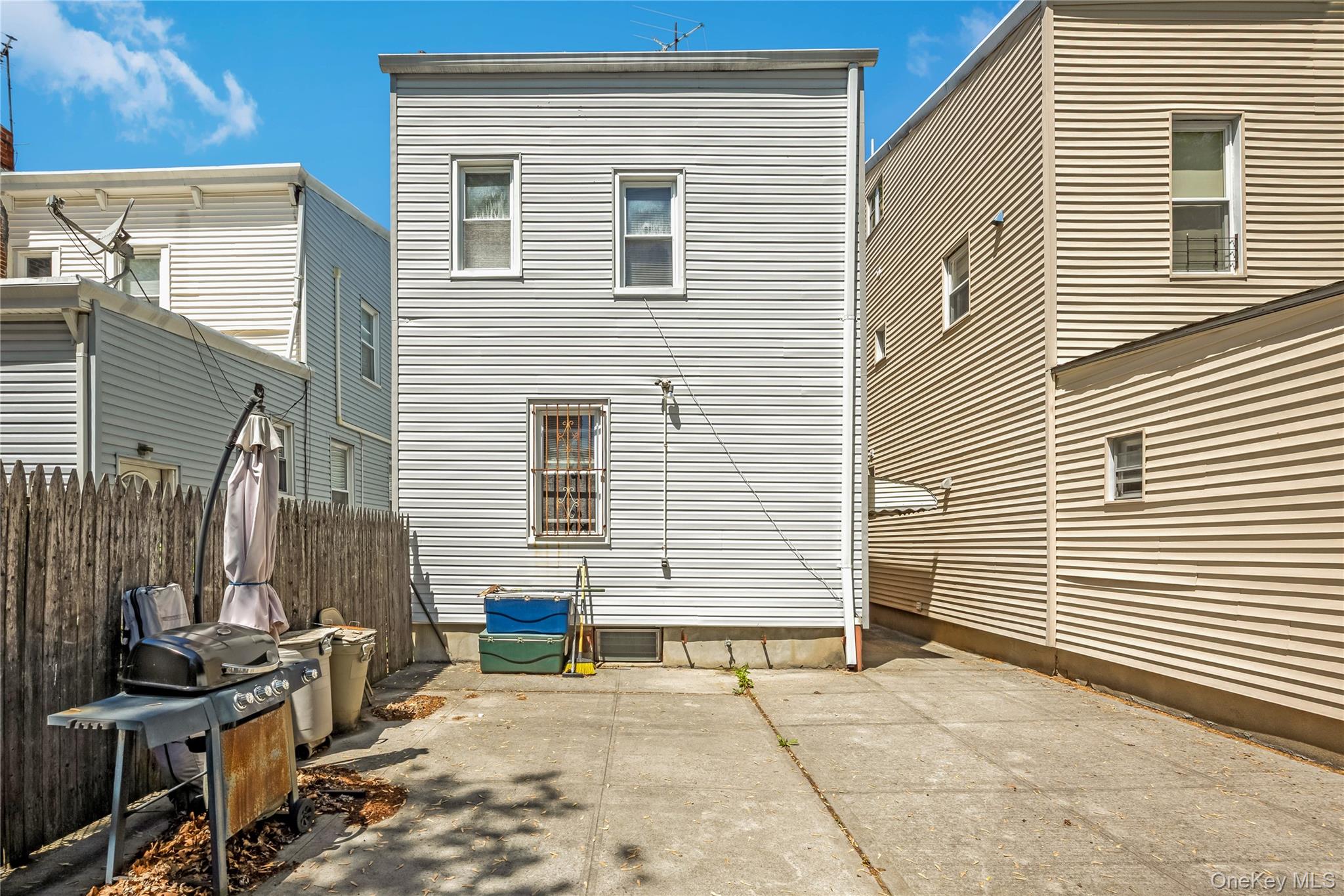 80-50 88th Road Queens, NY 11421 - Photo 19 of 21 a view of a house with a patio