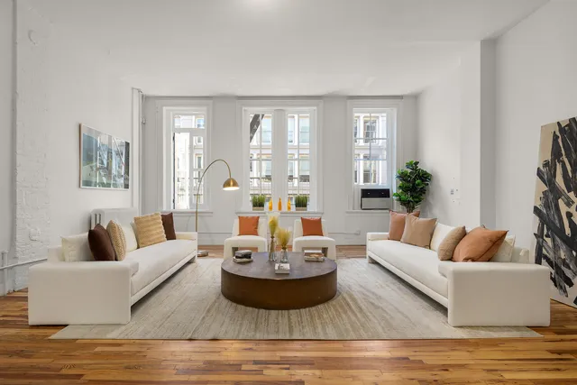 a living room with furniture and a table