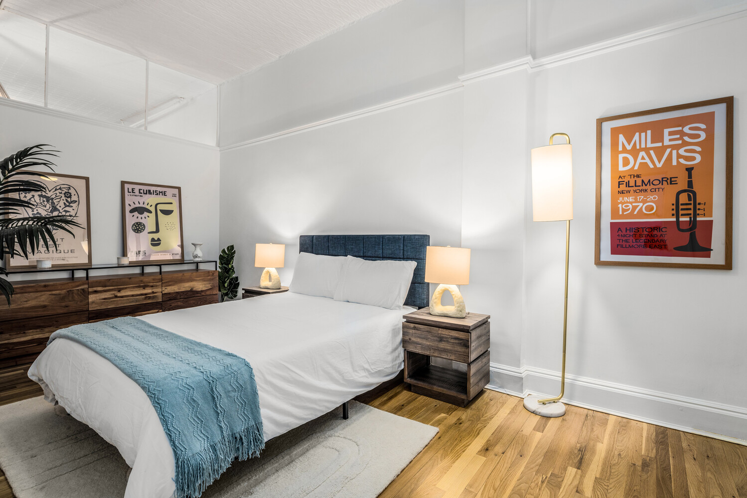 508 Broadway Manhattan, NY 10012 - Photo 21 of 38 a bedroom with a bed and wooden floor