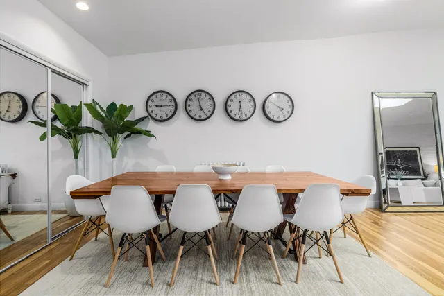 a view of a dining area with furniture and wooden floor