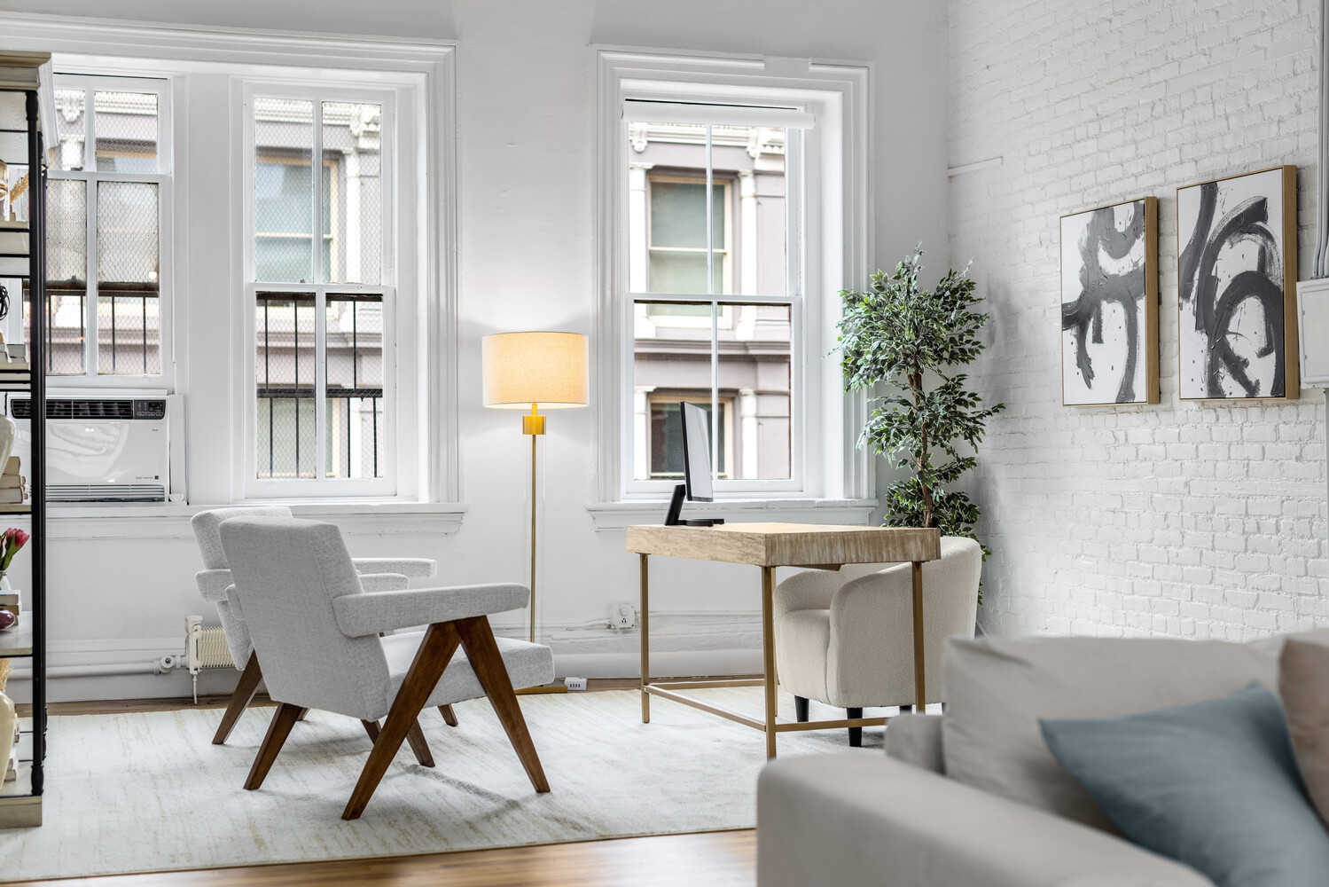 508 Broadway Manhattan, NY 10012 - Photo 34 of 38 a living room with furniture and a window