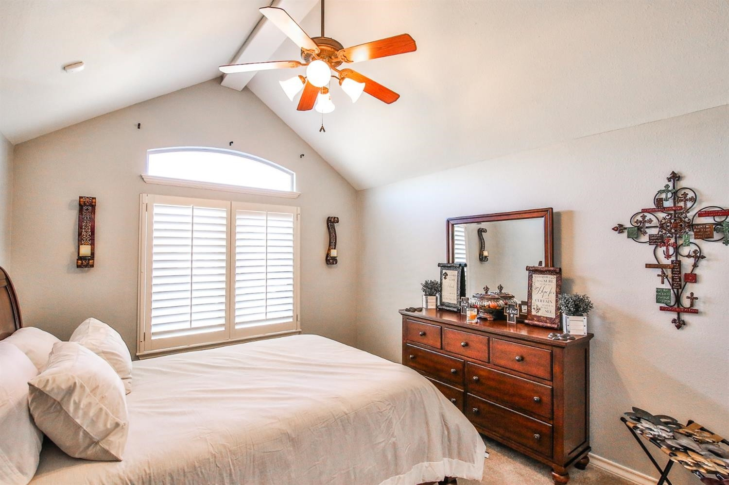 6015 85th Street Lubbock, TX 79424 - Photo 14 of 26 a bedroom with a bed and a chandelier