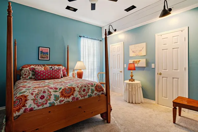 a bedroom with a bed and a cabinets