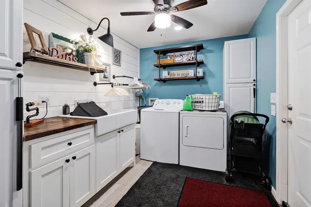 a kitchen with cabinets and window