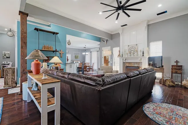 a kitchen with stainless steel appliances granite countertop a sink and wooden cabinets