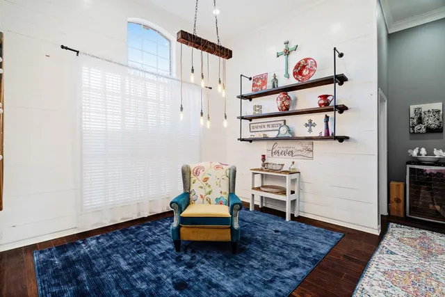 a bedroom with furniture and a rug