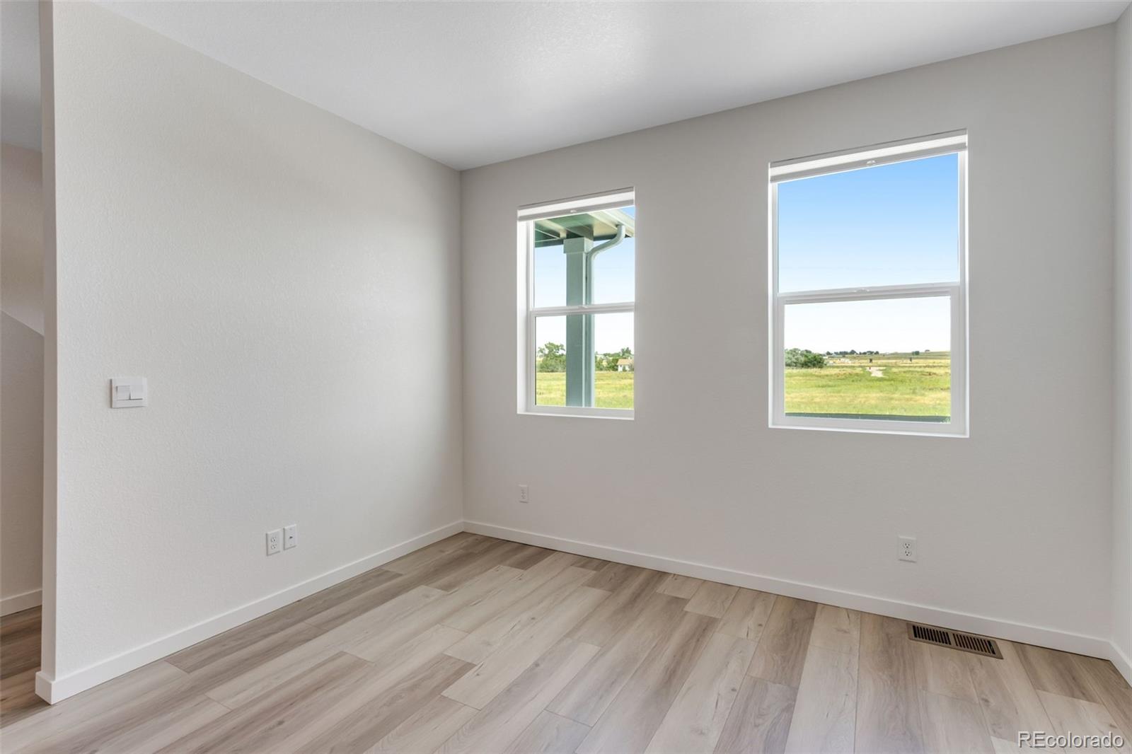2403 Pinot Place Fort Lupton, CO 80621 - Photo 3 of 20 an empty room with a window