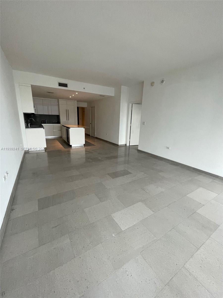 88 Southwest 7th Street, Unit 1608 Miami, FL 33130 - Photo 13 of 14 a view of empty room with a kitchen