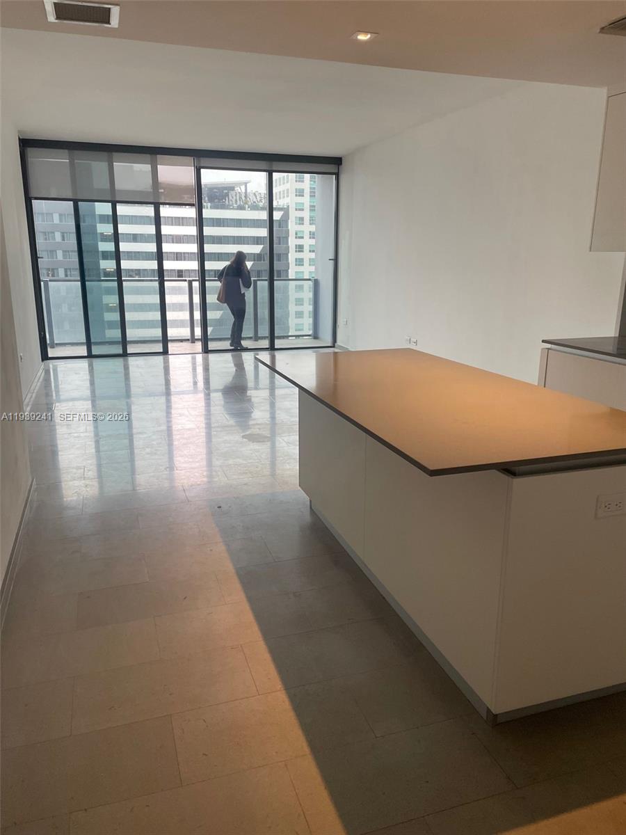 88 Southwest 7th Street, Unit 1608 Miami, FL 33130 - Photo 3 of 14 a room with pool table and floor to ceiling window