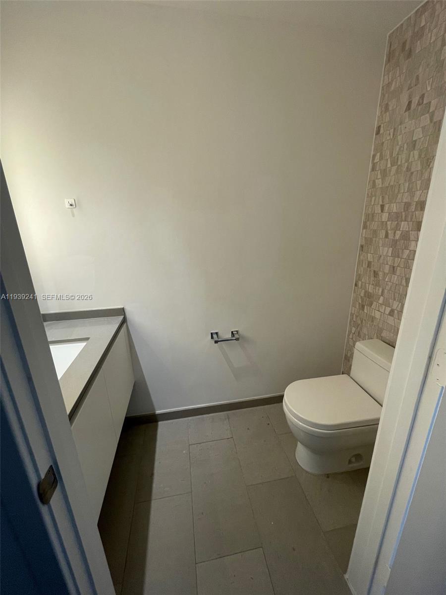 88 Southwest 7th Street, Unit 1608 Miami, FL 33130 - Photo 7 of 14 a bathroom with a toilet and a shower