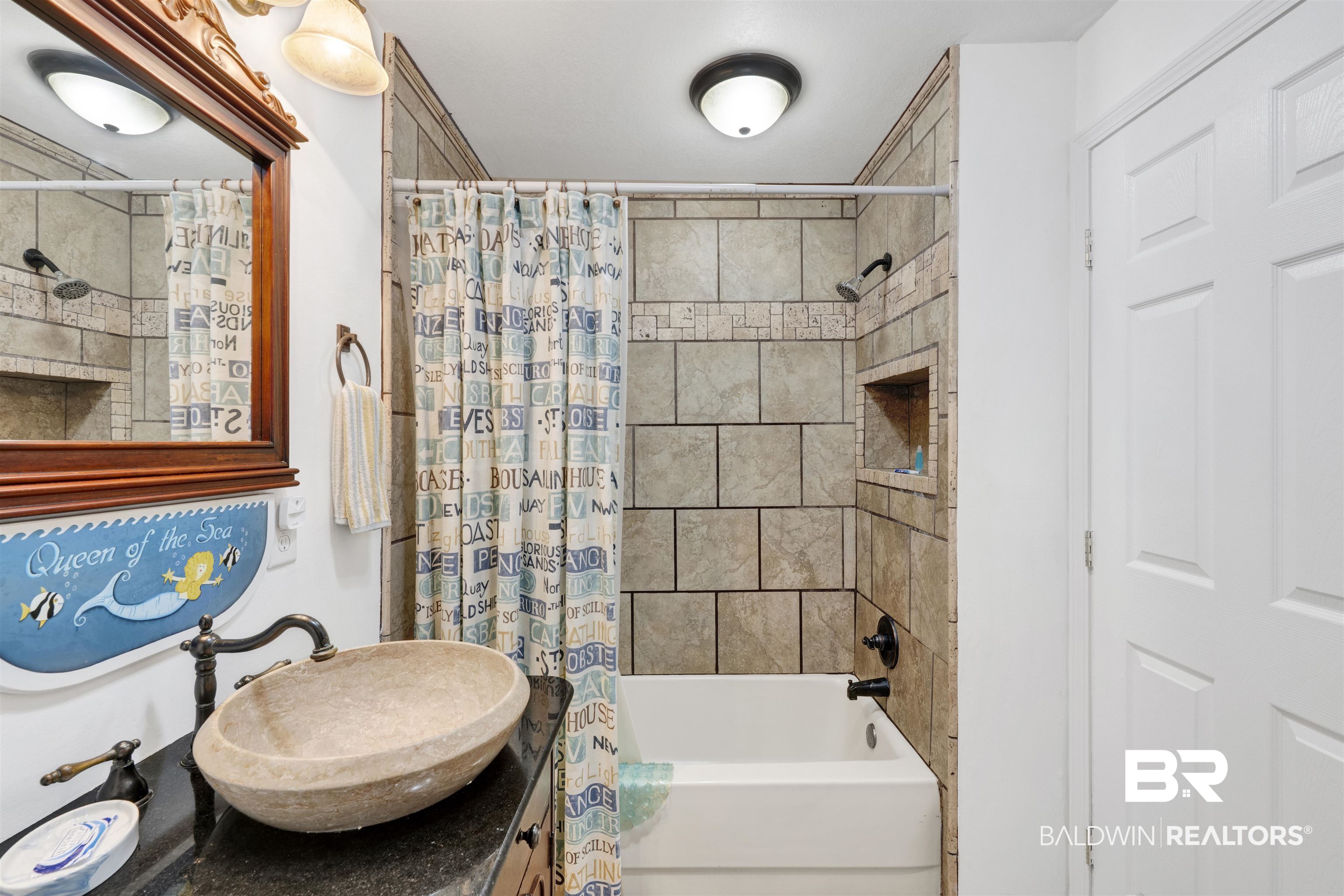 23770 Miflin Road Elberta, AL 36530 - Photo 13 of 38 Full bathroom featuring shower / tub combo with curtain and vanity