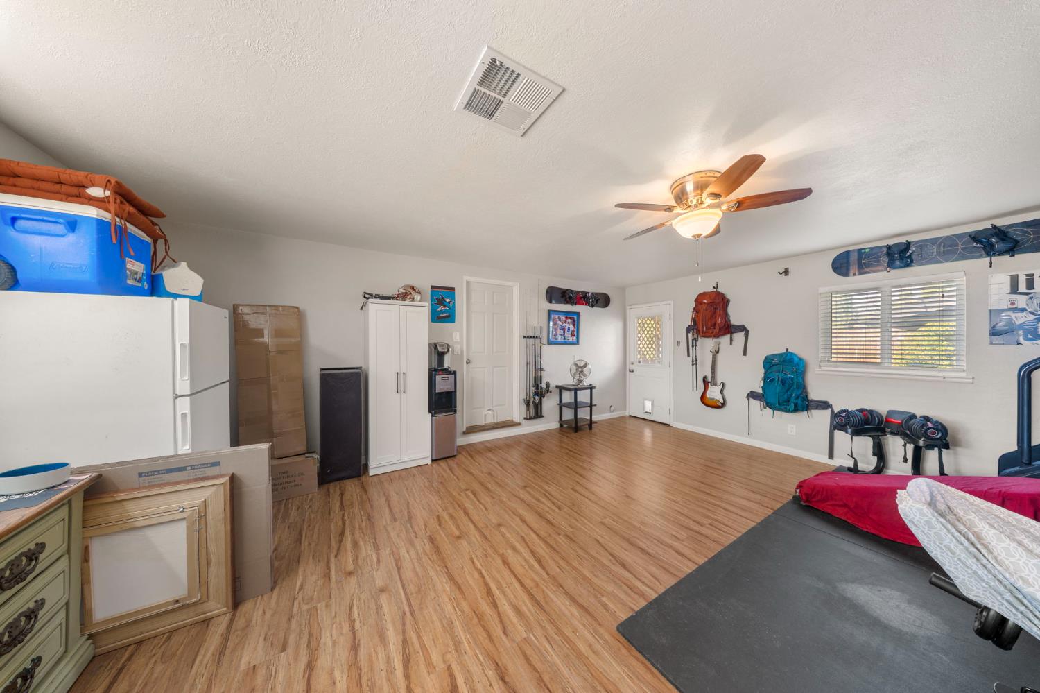 1405 Fordham Avenue Modesto, CA 95350 - Photo 18 of 32 a living room with stainless steel appliances furniture and a wooden floor