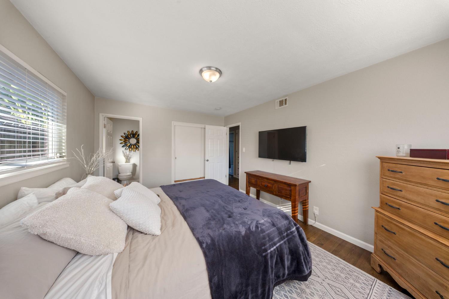 1405 Fordham Avenue Modesto, CA 95350 - Photo 26 of 32 a bedroom with a bed and a television
