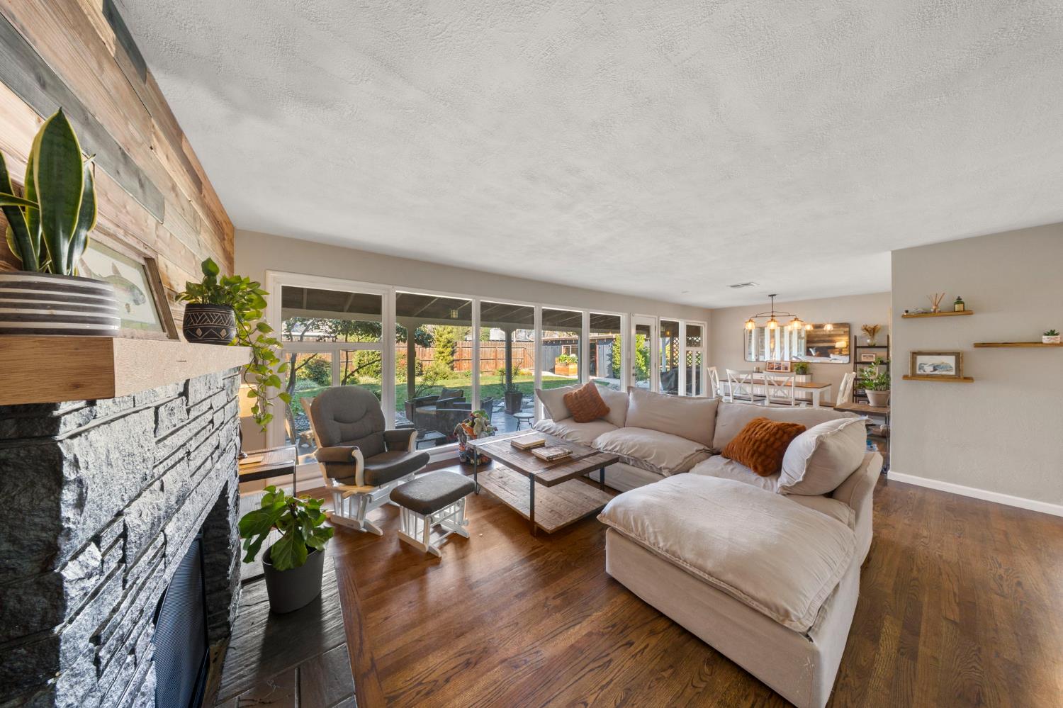 1405 Fordham Avenue Modesto, CA 95350 - Photo 8 of 32 a living room with furniture floor to ceiling window and wooden floor
