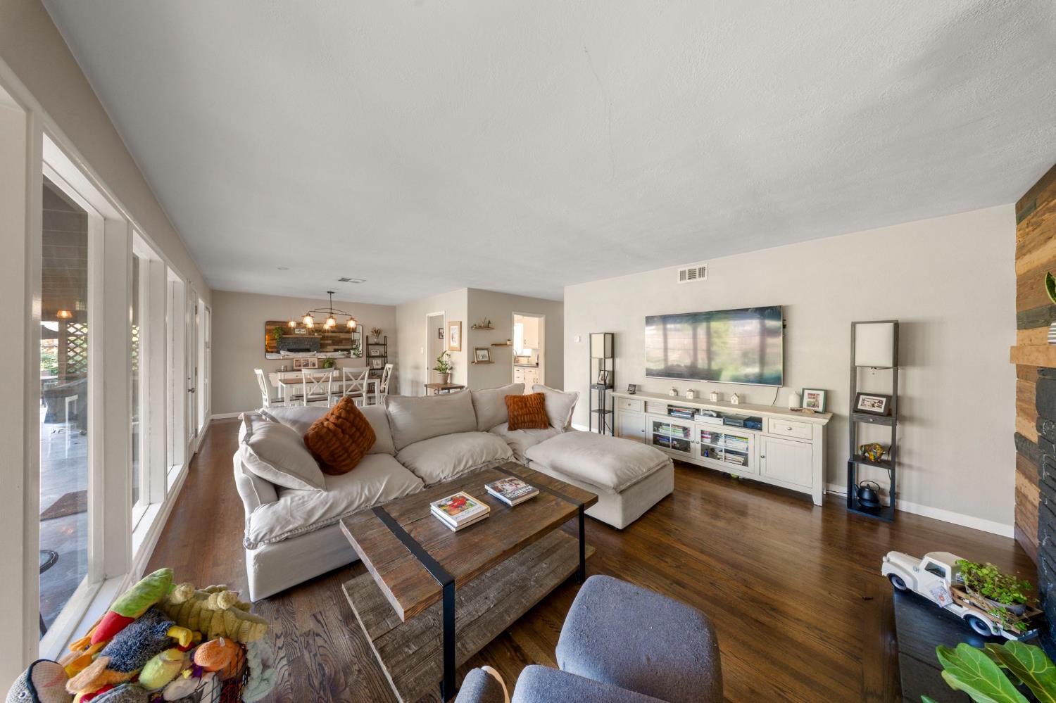 1405 Fordham Avenue Modesto, CA 95350 - Photo 10 of 32 a living room with furniture and a floor to ceiling window