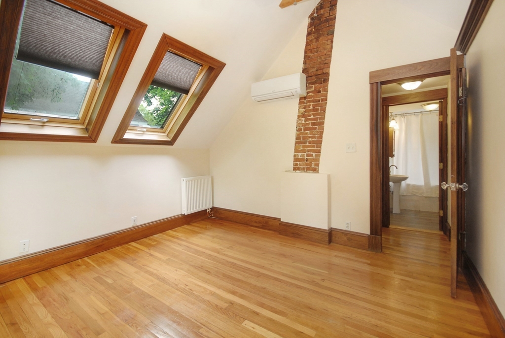 1832 Main Street Concord, MA 01742 - Photo 17 of 25 a view of an empty room with wooden floor and a window